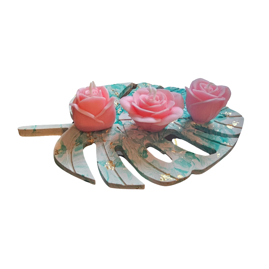 3 scented rose candles on a tray.